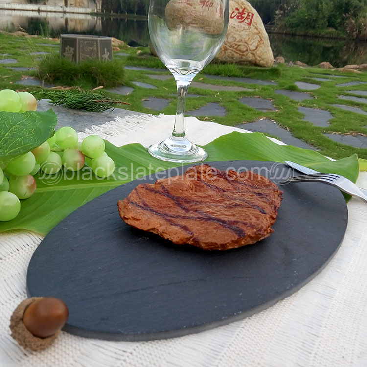 Oval shape black slate plate for steak